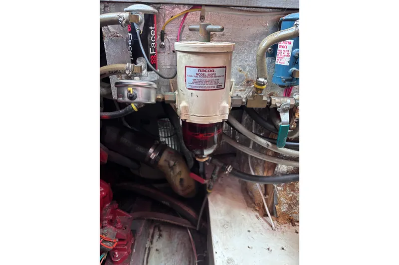 Slide: The Image of Engine compartment of 1985 Transpacific Marine Pacific Eagle 32 with Racor fuel filter system. - 35
