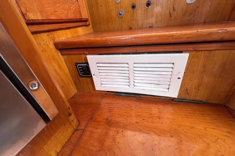 Slide: The Image of Wooden interior of 1985 Transpacific Marine Pacific Eagle 32 with white vent and fan control. - 40