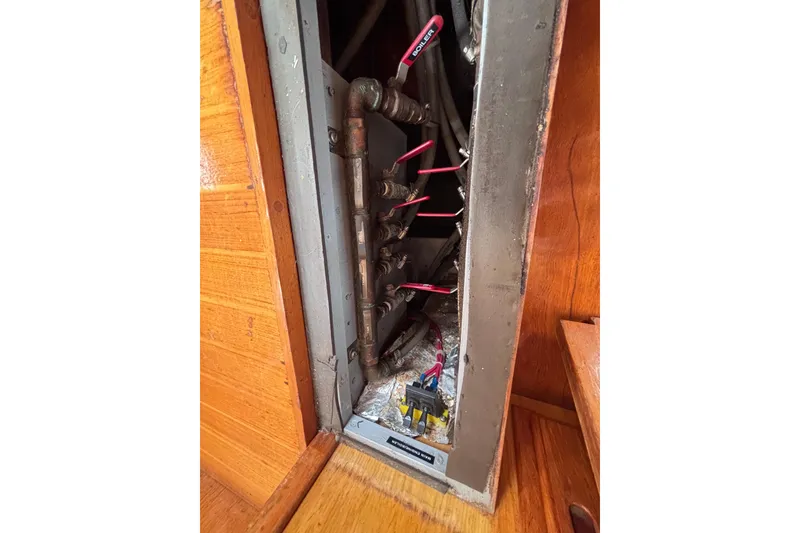 Slide: The Image of Electrical panel inside 1985 Transpacific Marine Pacific Eagle 32 boat, showing wiring and components. - 41