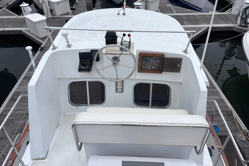 Slide: The Image of Helm of 1985 Transpacific Marine Pacific Eagle 32 yacht at marina dock. - 8