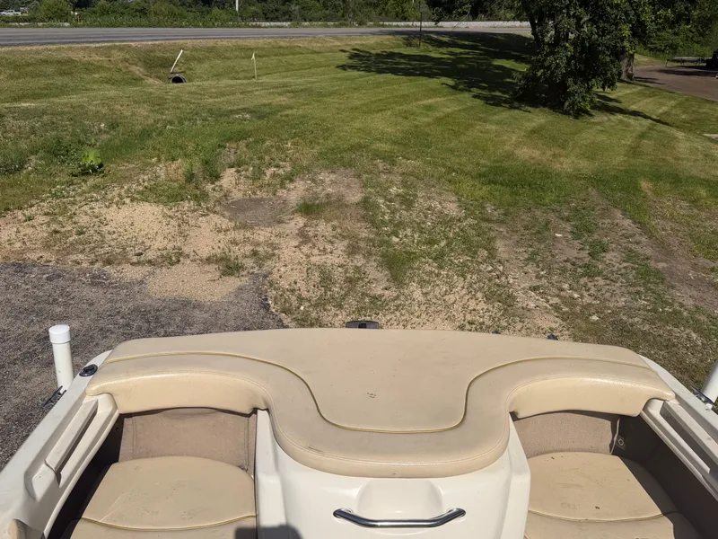 Slide: The Image of The image shows the cockpit of a 2001 Sea Ray 180 Bow Rider, on a trailer on land. - 13