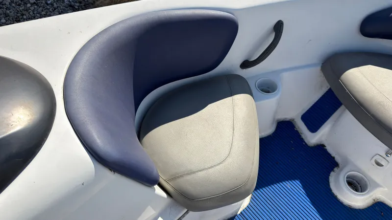 Slide: The Image of A seating area on a Sea-Doo Challenger 2000 boat with blue and gray upholstery. - 22