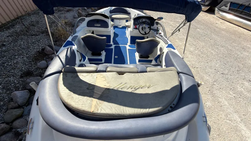 Slide: The Image of A 2002 Sea-Doo Challenger 2000 with blue and gray interior, sun pad, and helm station. - 8