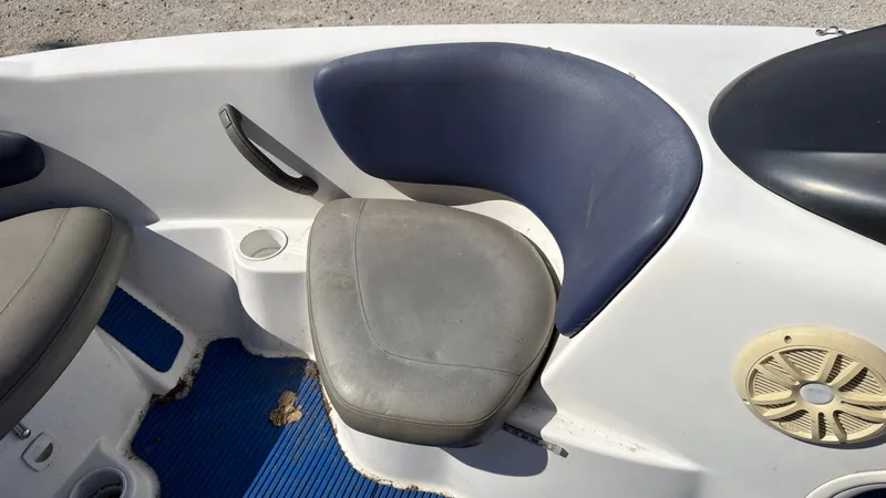 Slide: The Image of A seat in a 2002 Sea-Doo Challenger 2000 boat with a blue backrest. - 24