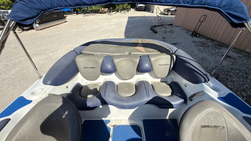 Slide: The Image of The image shows the cockpit of a 2002 Sea-Doo Challenger 2000 with blue and gray seating. - 9