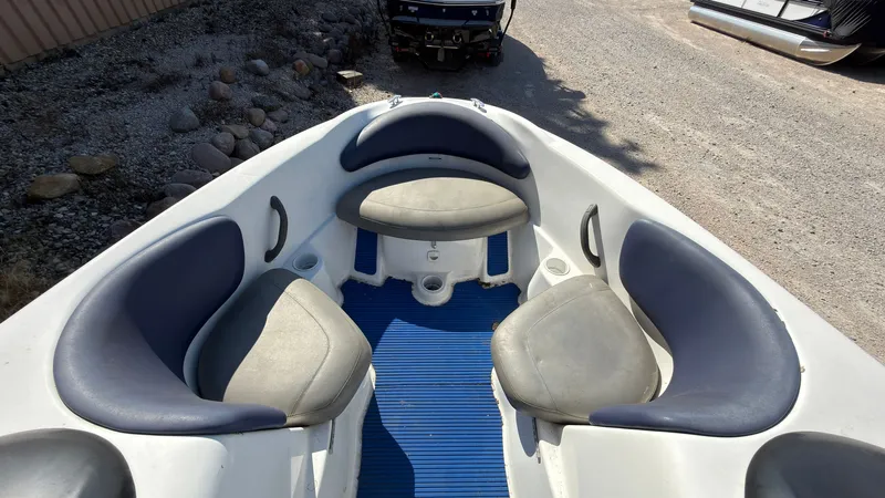 Slide: The Image of The image shows the bow of a 2002 Sea-Doo Challenger 2000 with blue and gray seating. - 21