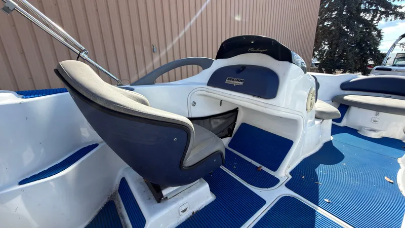 Slide: The Image of The image shows the cockpit of a 2002 Sea-Doo Challenger 2000 with blue seating. - 10