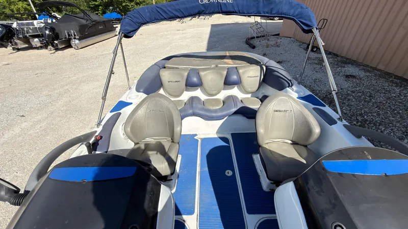 Slide: The Image of A 2002 Sea-Doo Challenger 2000 with blue and gray seating and a sunshade. - 19