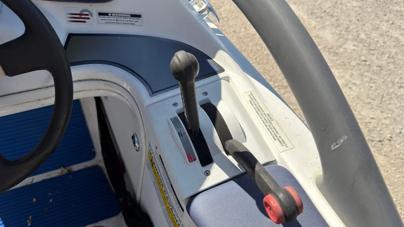 Slide: The Image of Close-up of a Sea-Doo Challenger 2000 control console with levers and steering wheel. - 17