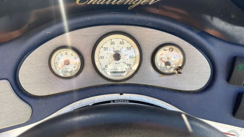 Slide: The Image of Close-up of a Sea-Doo Challenger 2000 dashboard with speedometer and gauges. - 15