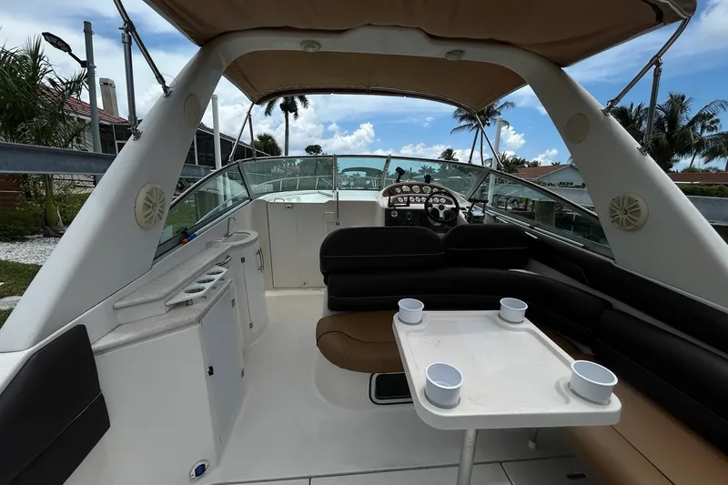 Slide: The Image of Interior view of a 2000 Monterey 330 Sport Yacht with seating and table. - 9