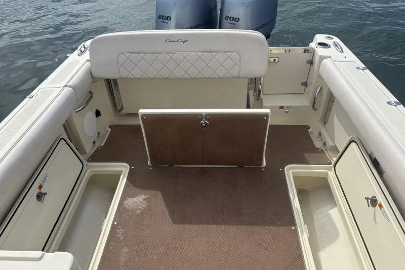 Slide: The Image of 2017 Chris-Craft Calypso 26 boat interior with twin 200 horsepower engines. - 17