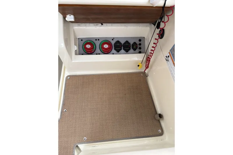 Slide: The Image of 2017 Chris-Craft Calypso 26 boat interior with control panel and safety features. - 20