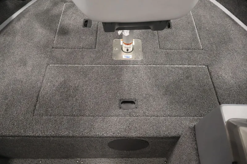 Slide: The Image of 2027 Lowe Fishing Machine 1625SC boat interior with gray carpeted flooring. - 37