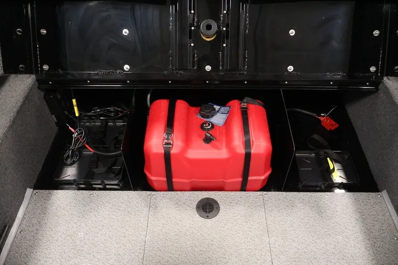 Slide: The Image of 2027 Lowe Fishing Machine 1625SC boat storage with red fuel tank and wiring. - 20