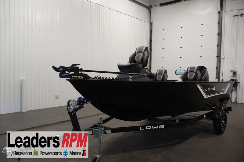 The Image of 2027 Lowe Fishing Machine 1625SC boat in showroom, featuring sleek design and modern seating. - 0