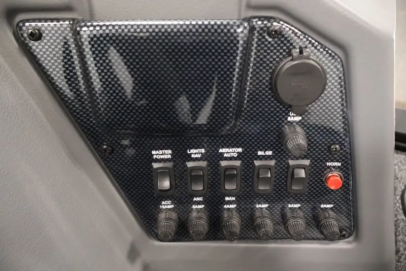Slide: The Image of Control panel of 2027 Lowe Fishing Machine 1625SC with switches and power outlets. - 38