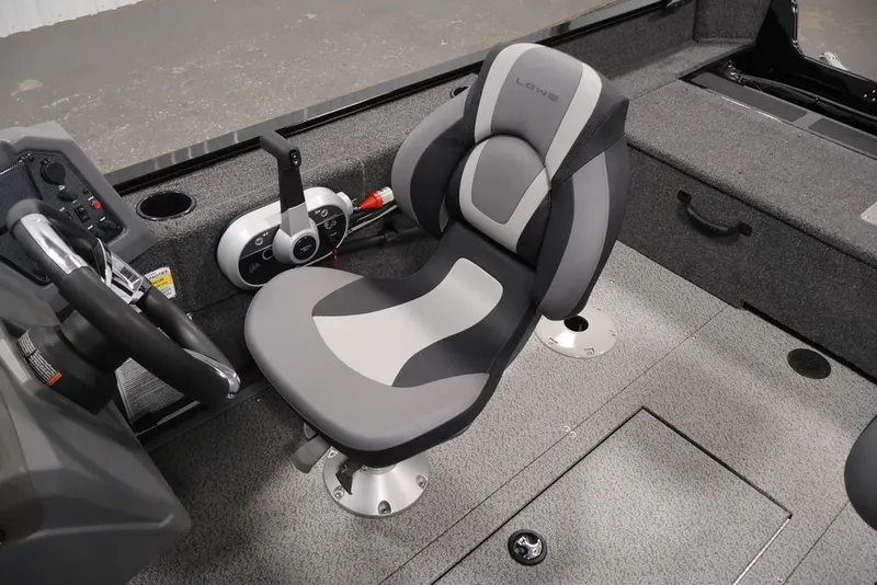Slide: The Image of 2027 Lowe Fishing Machine 1625SC interior with steering wheel and comfortable seating. - 29