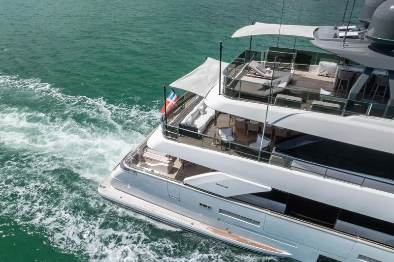 Slide: The Image of Luxurious 2023 Custom Line Navetta 33 yacht cruising on turquoise waters. - 10