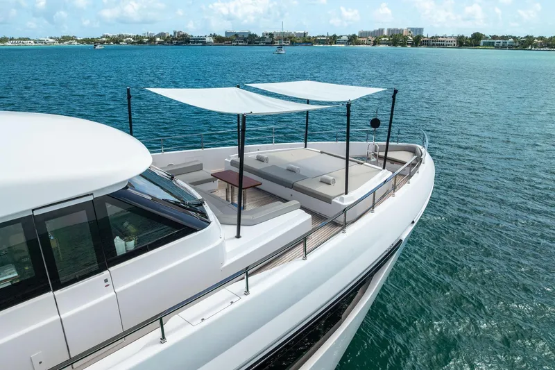 Slide: The Image of Luxurious 2023 Custom Line Navetta 33 yacht cruising on serene blue waters. - 15