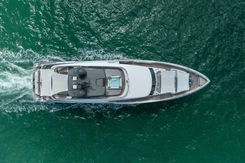 Slide: The Image of Aerial view of 2023 Custom Line Navetta 33 yacht cruising on open water. - 17