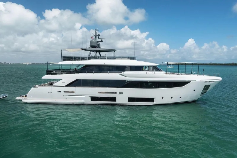 Slide: The Image of Luxurious 2023 Custom Line Navetta 33 yacht cruising on clear blue waters. - 2