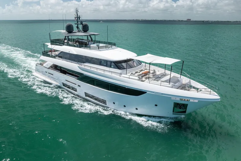 Slide: The Image of Luxurious 2023 Custom Line Navetta 33 yacht cruising on turquoise waters. - 4