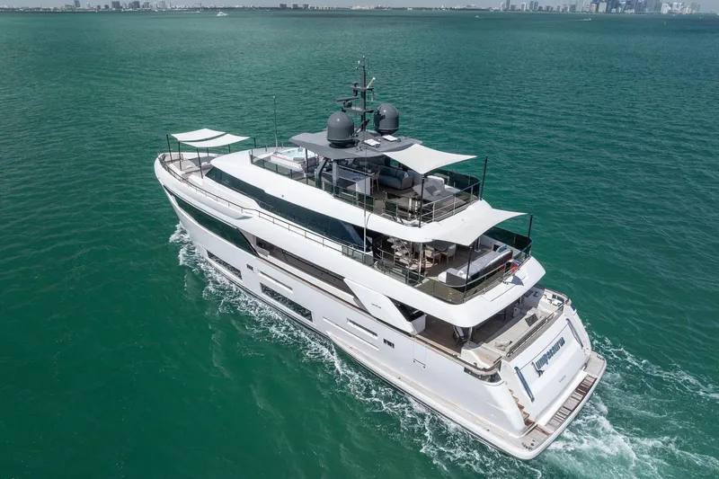 Slide: The Image of Luxurious 2023 Custom Line Navetta 33 yacht cruising on turquoise waters. - 8