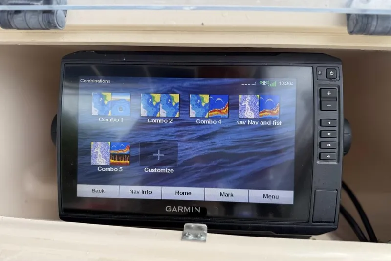 Slide: The Image of Garmin navigation system on 1999 Grady-White Islander 268 boat dashboard. - 11