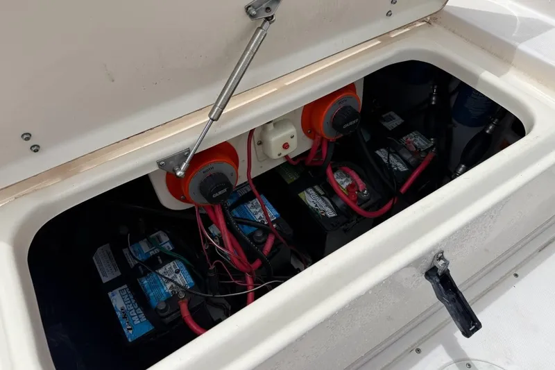 Slide: The Image of Battery compartment of a 1999 Grady-White Islander 268 boat, showing wiring and connections. - 17