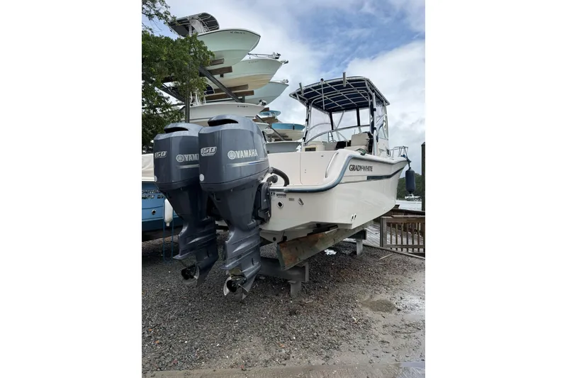 Slide: The Image of 1999 Grady-White Islander 268 boat with twin Yamaha 150 engines on display. - 3
