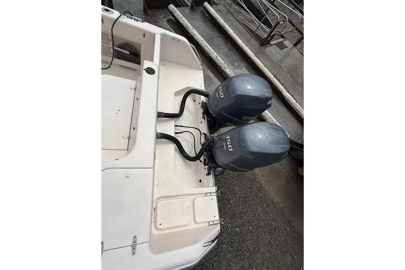 Slide: The Image of 1999 Grady-White Islander 268 boat with dual 150 horsepower outboard motors. - 7