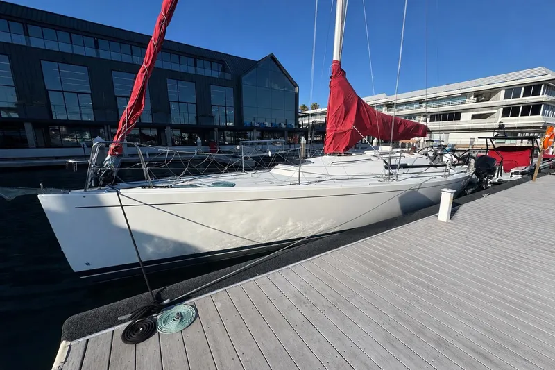 The Image of Sleek 2006 J Boats J/124 yacht docked at a modern marina. - 0