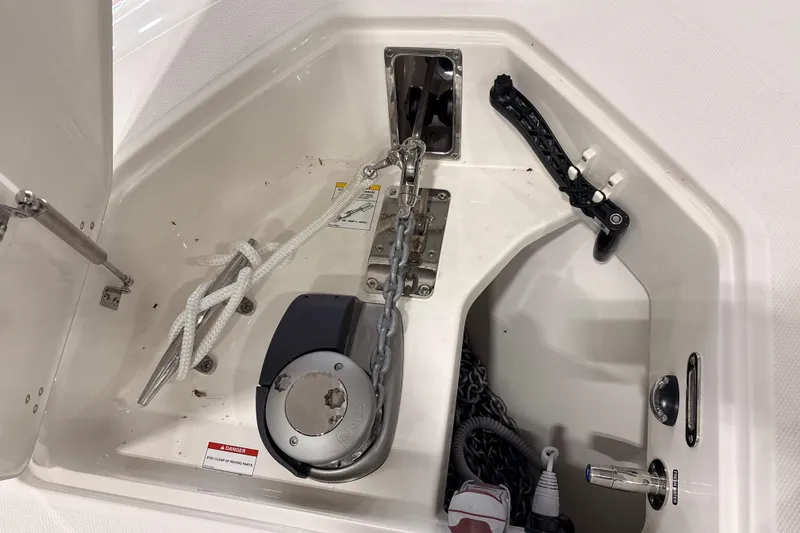 Slide: The Image of Anchor compartment of 2026 Boston Whaler 380 Outrage, featuring chain and rope storage. - 26