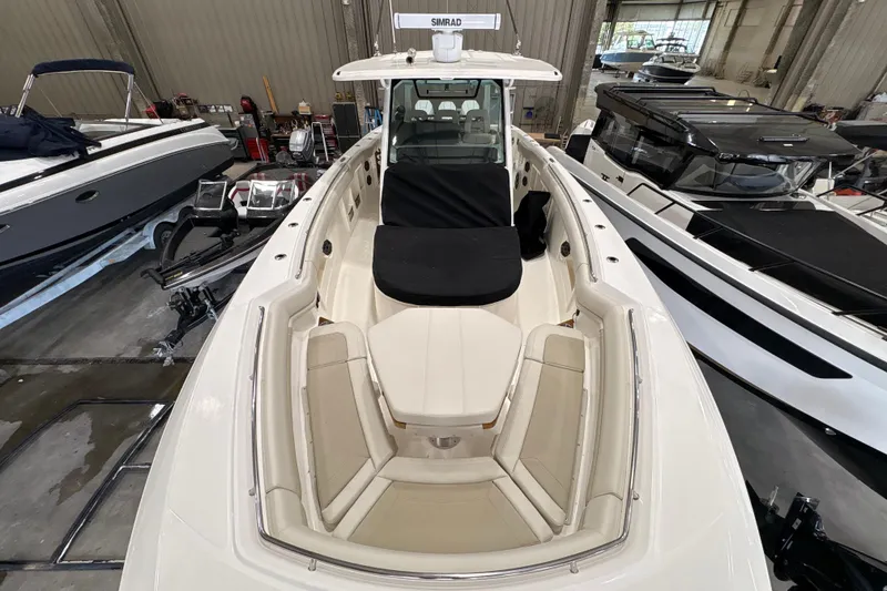 Slide: The Image of 2026 Boston Whaler 380 Outrage boat interior, featuring spacious seating and modern design. - 28