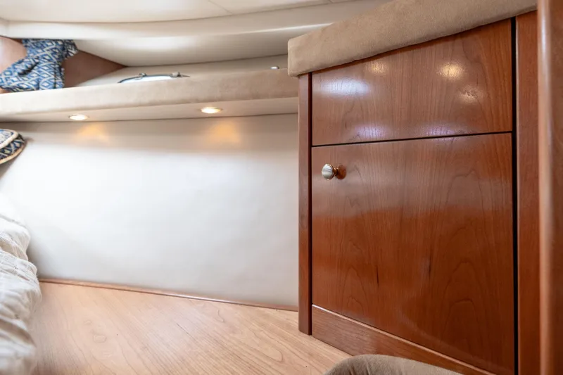 Slide: The Image of 2003 Meridian 490 Pilothouse interior with wooden cabinet and cozy lighting. - 31