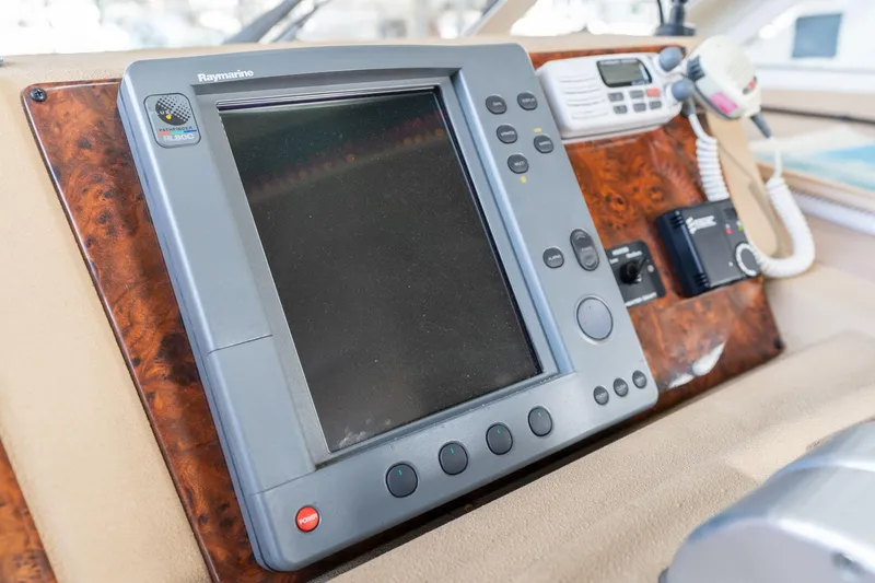 Slide: The Image of Control panel of a 2003 Meridian 490 Pilothouse yacht with navigation equipment. - 46