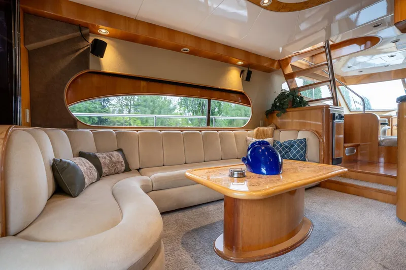 Slide: The Image of Luxurious interior of 1999 Vitech 68' Pilothouse yacht with elegant seating and wooden accents. - 10