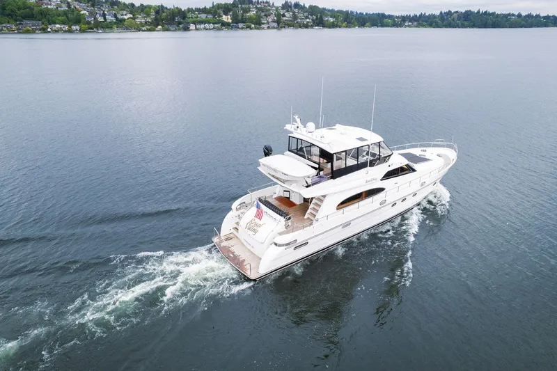 Slide: The Image of 1999 Vitech 68' Pilothouse yacht cruising on a calm lake. - 2