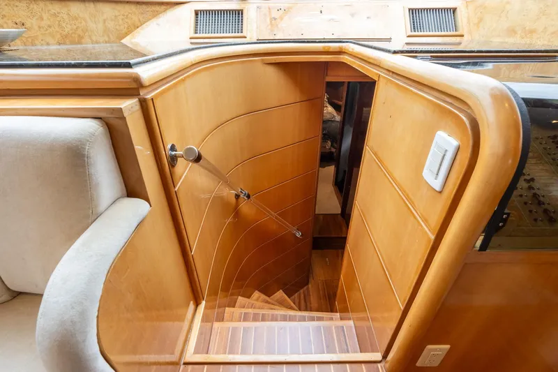 Slide: The Image of Interior staircase of 1999 Vitech 68' Pilothouse yacht with wooden finish. - 30