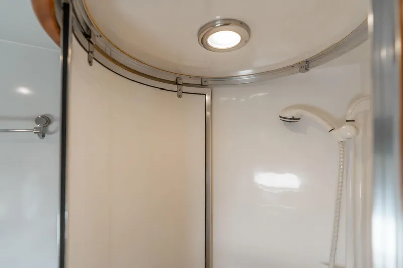 Slide: The Image of Shower area in 1999 Vitech 68' Pilothouse yacht, featuring modern fixtures and lighting. - 42