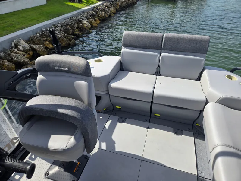 Slide: The Image of A 2024 Sea-Doo Switch with gray seating on calm water. - 3