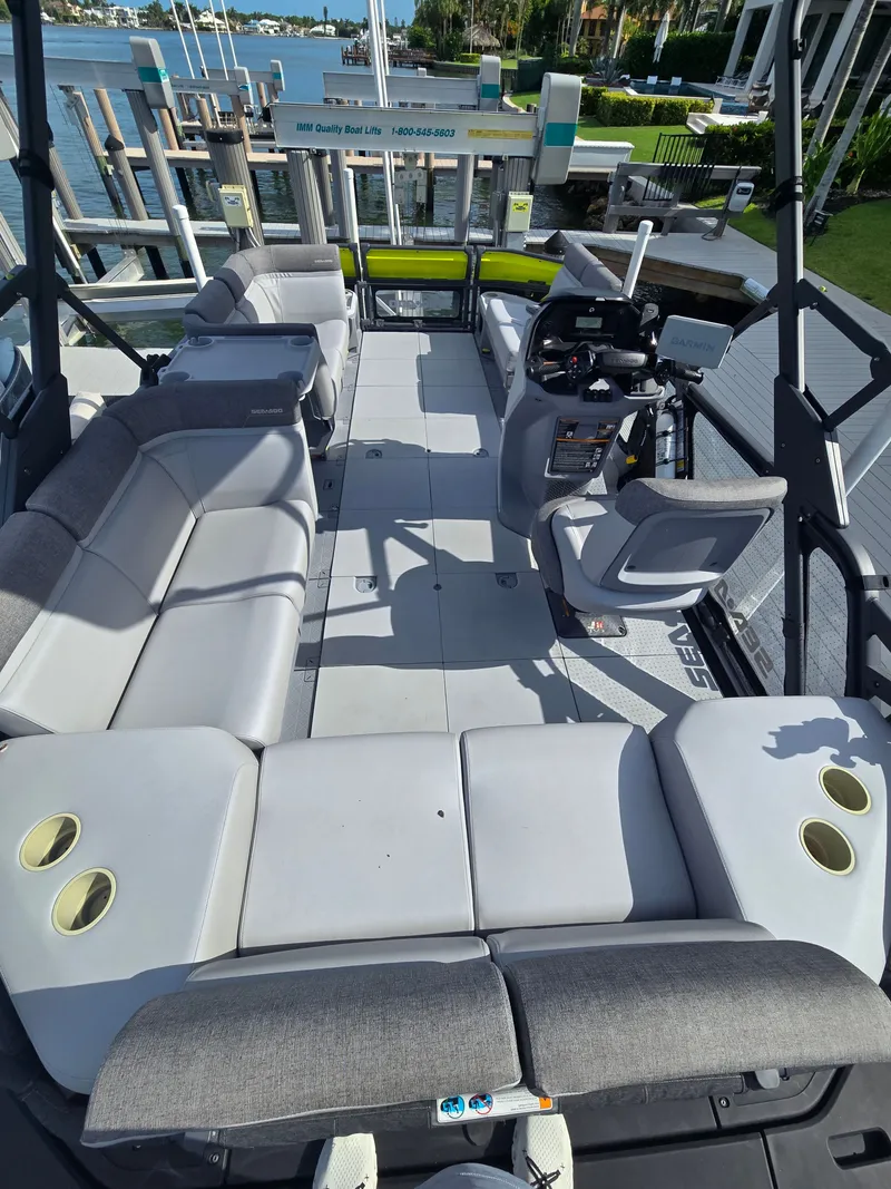 Slide: The Image of The image shows the interior of a Sea-Doo Switch boat with gray seating and a helm. - 5