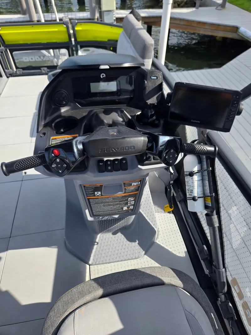 Slide: The Image of The cockpit of a Sea-Doo Switch with steering wheel and instruments. - 6