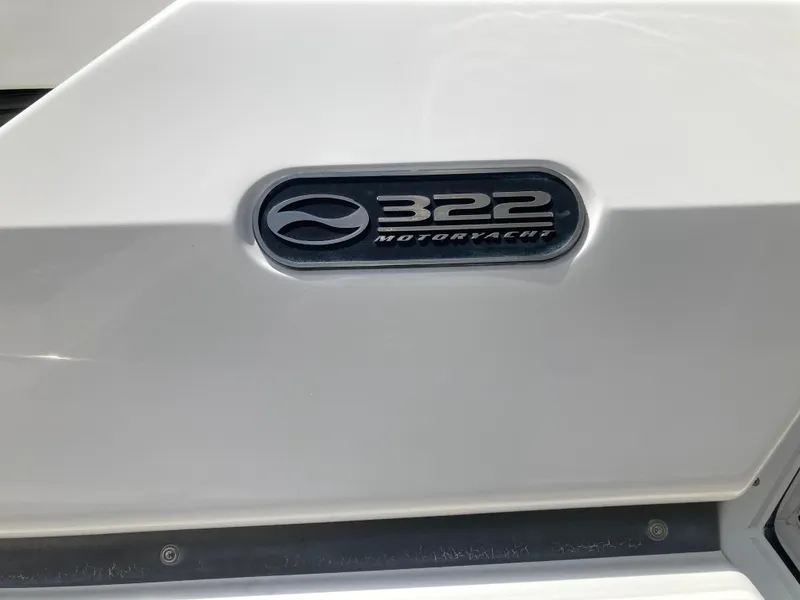 Slide: The Image of Close-up of the Silverton 322 Motor Yacht logo on a white background. - 12