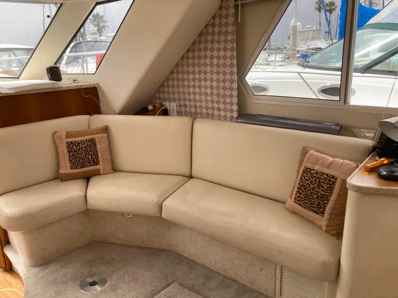Slide: The Image of Interior of a Silverton 322 Motor Yacht with beige sofa and decorative pillows. - 15