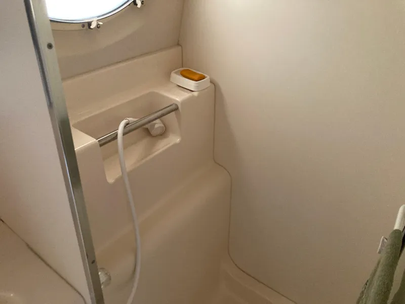 Slide: The Image of A yacht shower with a handheld showerhead and soap dish. - 30
