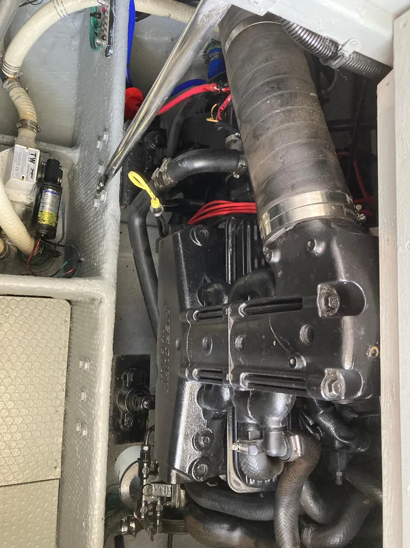 Slide: The Image of Engine compartment of a 1999 Silverton 322 Motor Yacht with visible engine. - 33
