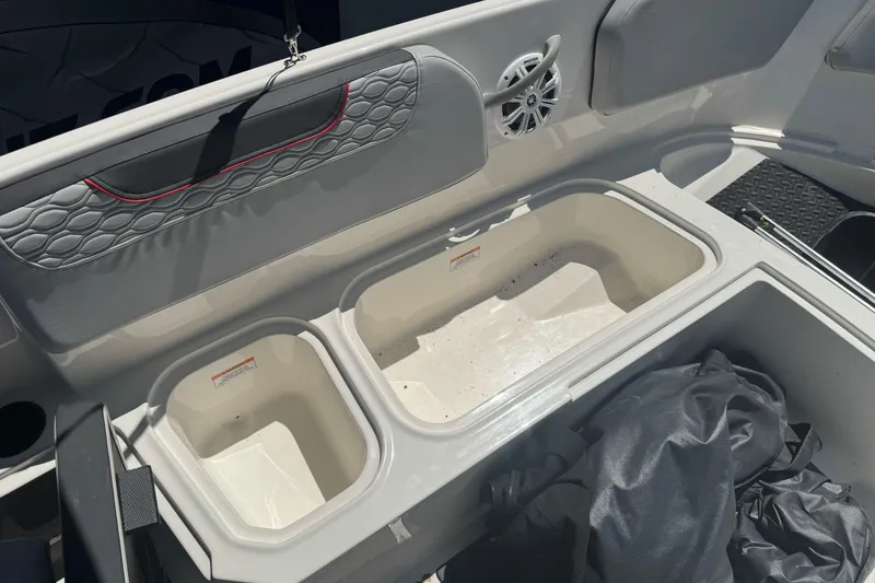 Slide: The Image of 2023 Bayliner Element M15 boat interior with storage compartments and speaker. - 17