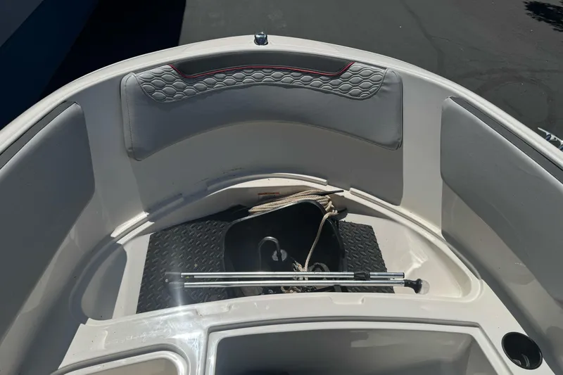 Slide: The Image of 2023 Bayliner Element M15 boat interior with seating and storage area. - 18